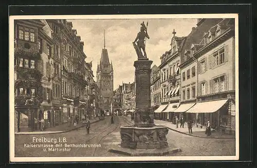 AK Freiburg i. B., Kaiserstrasse mit Geschäften, Bertholdsbrunnen und Martinstor