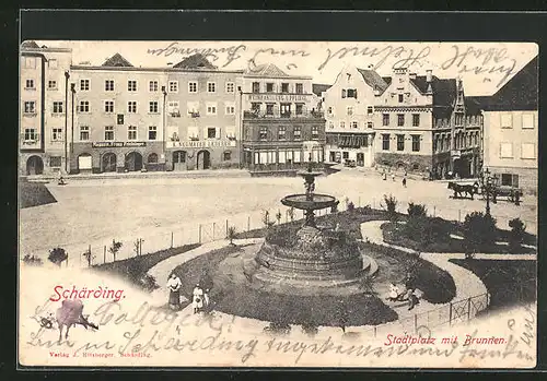 AK Schärding, Stadtplatz mit Geschäften und Brunnen