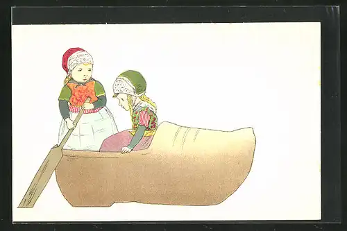 AK zwei Mädchen in niederländischen Trachtkleidern rudern in einem grossen Holzschuh