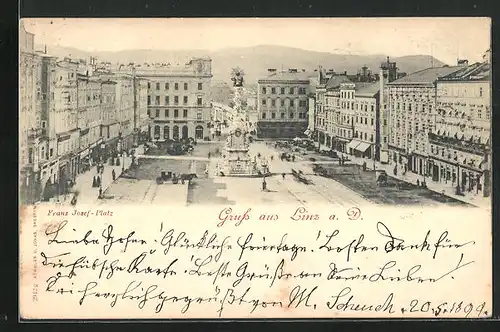 AK Linz a. D., Franz Josef-Platz mit Geschäften und Denkmal