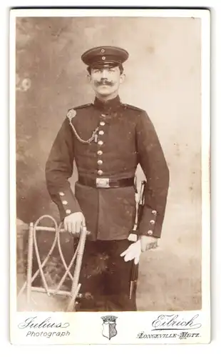 Fotografie Julius Eibrich, Longeville-Metz, Portrait Soldat mit Schützenschnur