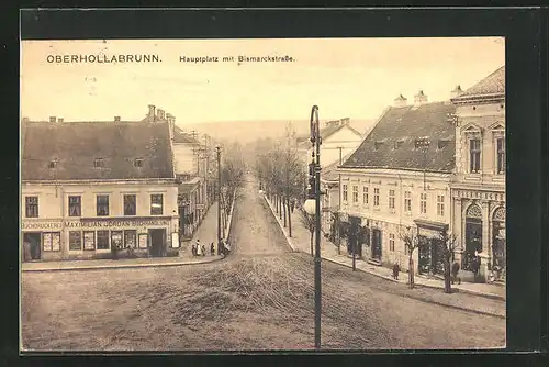AK Oberhollabrunn, Hauptplatz und Bismarckstrasse mit Geschäften