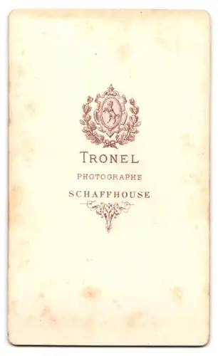 Fotografie A. Tronel, Schaffhouse, Portrait süsses Kleinkind im hübschen Kleid