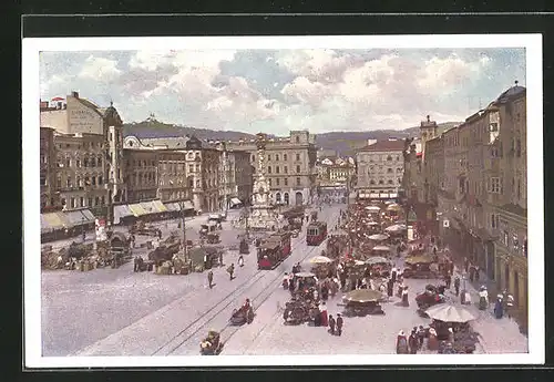 AK Linz a. D., Strassenpartie mit Gebäudeansicht und Denkmal, Strassenbahn