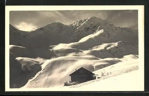 AK Schwarzwasserhütte im Schnee mit Alpenpartie