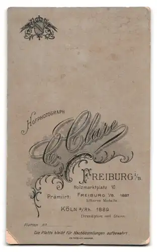 Fotografie C. Clare, Freiburg i. B., Holzmarktplatz 10, Portrait junge Dame im Mieder mit Rüschenbluse