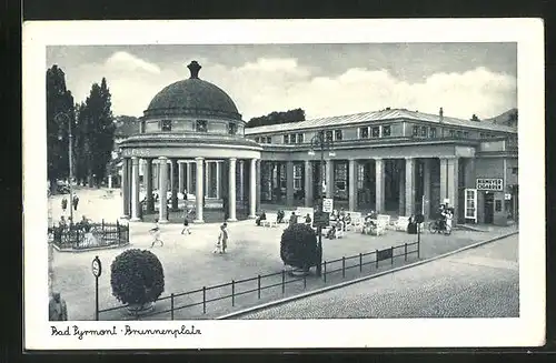 AK Bad Pyrmont, Brunnenplatz mit Wandelhalle & Zigarrengeschäft