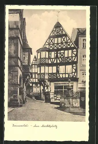 AK Bernkastel, Am Marktplatz mit Geschäft und Brunnen