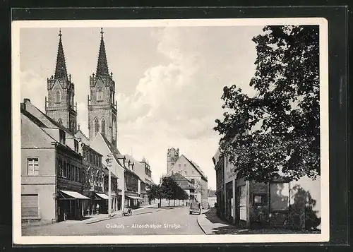 AK Oschatz, Altoschatzer Strasse mit Kirche