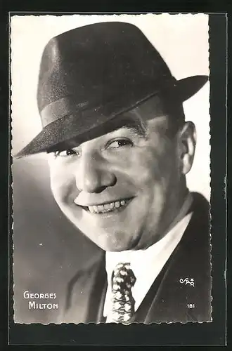 AK Schauspieler Georges Milton mit verschmitztem Lachen und Hut