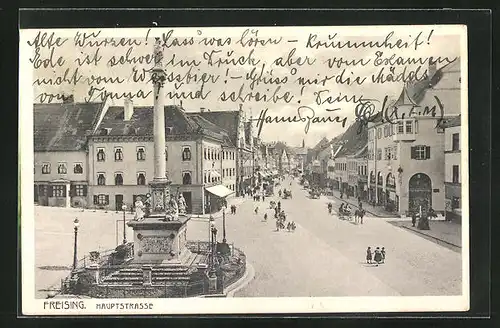AK Freising, Hauptstrasse mit Geschäften und Denkmal