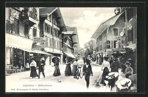 AK Interlaken, Höhestrasse mit Spaziergängern und Geschäften