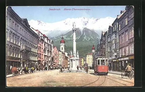 AK Innsbruck, Maria-Theresienstrasse mit Geschäften und Denkmal, Strassenbahn