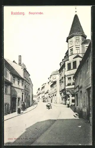 AK Radeberg, Hauptstrasse mit Restaurant und Geschäften