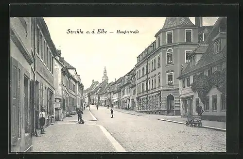 AK Strehla / Elbe, Hauptstrasse mit Kirchturm