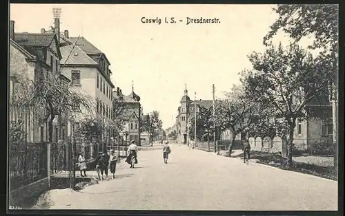 AK Coswig i. S., Dresdnerstrasse mit Radfahrer