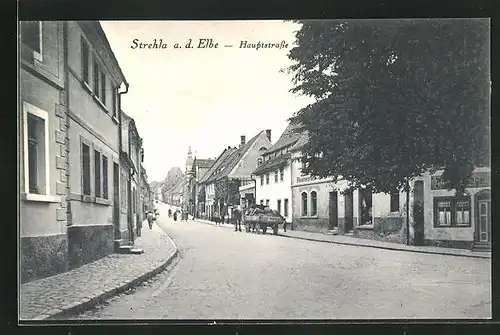 AK Strehla a. d. Elbe, Hauptstrasse mit Restaurant & Geschäften