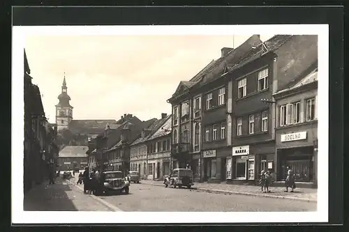 AK Mimon, Strassenpartie mit Geschäften und Kirche