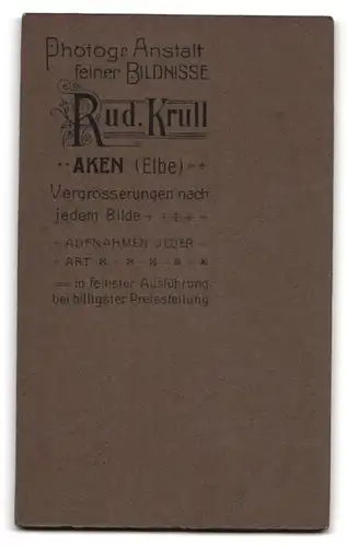 Fotografie Rud. Krull, Aken /Elbe, Portrait junge Dame mit moderner Frisur und Buch