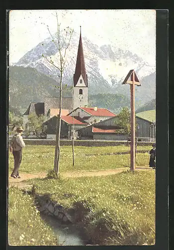 AK Reutte, Ortspartie mit Kirche im Frühling