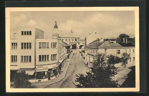 AK Holesov, Strassenpartie mit Geschäften und Kirche