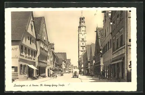 AK Lauingen a. d. Donau, Ob. Herzog-Georg-Strasse mit Café, Geschäften und Kirche