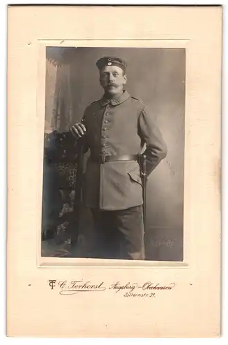 Fotografie C. Terhorst, Augsburg-Oberhausen, Zollernstrasse 31, Portrait Soldat in Uniform mit Schnauzbart