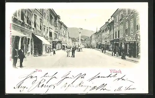 AK Villach, Platz mit Geschäften und Denkmal