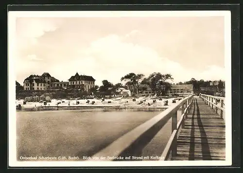 AK Scharbeutz, Blick von der Seebrücke auf den Strand mit dem Kurhaus Warnings Strandhotel