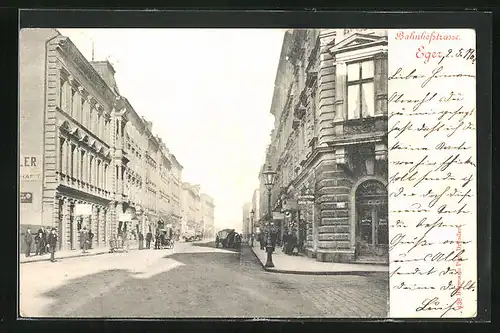 AK Eger, Bahnhofstrasse mit Ladenzeile