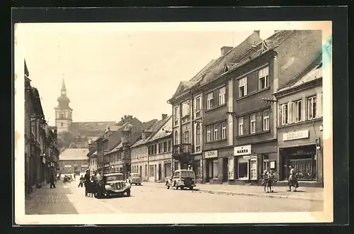 AK Mimon, Strassenszene in der Stadt, Blick zur Kirche