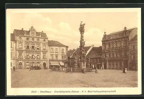 AK Dux / Duchcov, Stadthaus, Dreifaltigkeitsstatue, K. k. Bezirkshauptmannschaft