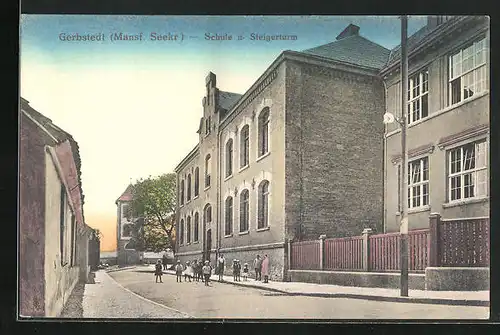 AK Gerbstedt / Manns. Seekr., Strassenpartie an der Schule und Steigerturm