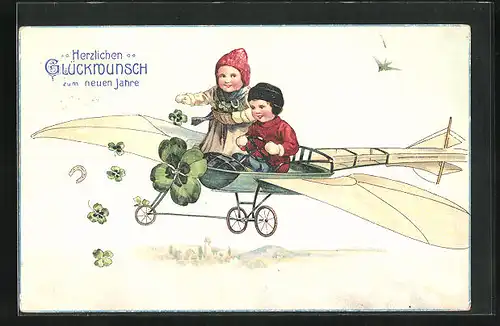 AK Kinderpaar im Flugzeug mit Kleeblättern, Neujahrsgruss