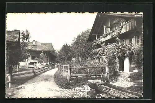 AK Sigriswyl, Dorfstrasse mit Brunnen