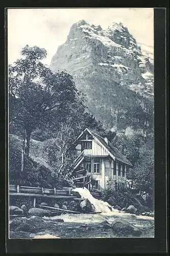 AK Grindelwald, Haus am Bach gegen Bergmassiv