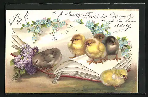 Lithographie Osterküken mit Blüten auf einem aufgeklappten Buch