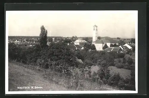 AK Nikitsch /N. Donau, Blick über die Dächer, Kirche