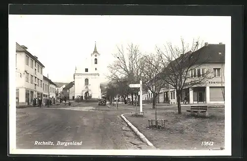 AK Rechnitz, Strassenpartie mit Kirche