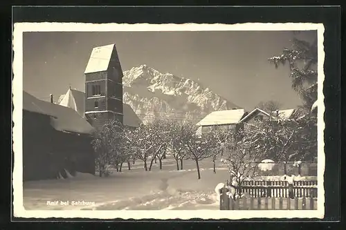 AK Anif bei Salzburg, Schneebedeckter Ort mit Kirche und Berg
