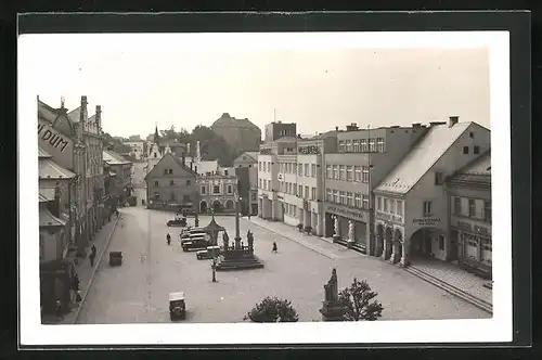 AK Nová Paka, Grosser Marktplatz mit Geschäften