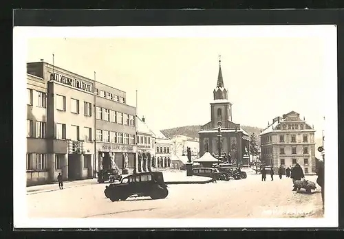 AK Nova Paka, Strassenpartie mit Kirche im Winter