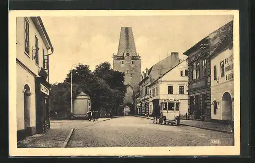 AK Kaaden /Eger, Strassenpartie mit Kutsche des Hotel Baums, Stadtturm