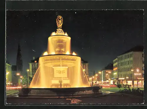 AK Würzburg, Kiliansbrunnen und Geschäfte bei Nacht