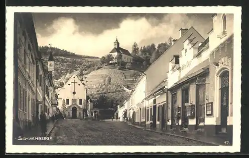 AK Schwanberg, Strassenpartie mit Geschäften und Kirche