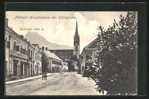 AK Admont, Hauptstrasss mit Geschäften und Stiftskirche, Im Hintergrund Hahnstein