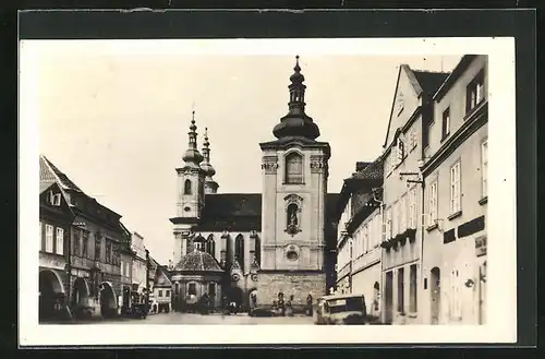 AK Zatec, Strassenpartie mit Kirche