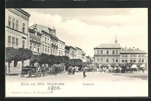 AK Mähr.-Weisskirchen, Stadtplatz mit Geschäften und Passanten