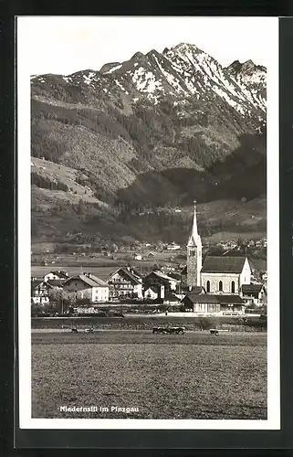 AK Niedernsill im Pinzgau, Teilansicht mit Kirche, Kuhweide
