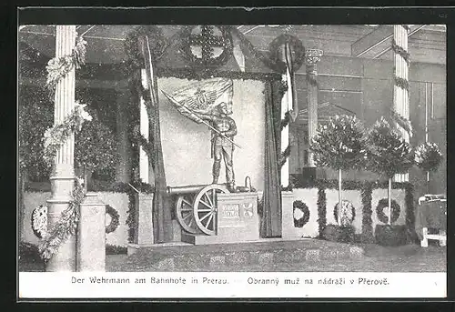 AK Prerau, Geschmückte Säulen beim Wehrmann am Bahnhof, Nagelung